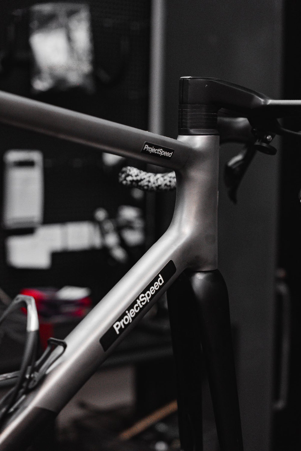 Head tube area of the Sasaye titanium frame with ProjectSpeed labels